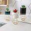 Ceramic vases, vials of Nordic ironwork, simple frame arrangement, gold-plated flowerpot