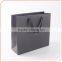 Luxury matte black shopping paper bag with logo embossing for clothing packaging