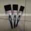 green plastic handle paint brush