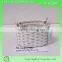 small round wicker storage basket with two ears