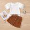 2020 Hot Sale New Creative Pure White Feather Sleeve T-shirt + Metal Button Corduroy Short Skirt Set