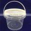 Transparent 500ml plastic bucket with lid and handle.