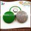 green fabric covered metal brass shank button