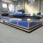 Fabric laser cutter with auto feeder and calibration system