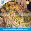 Ho scale model railroad with train cars and mini figures