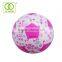 Happy kid play toy of rolling ball with flower pattern for girl and boy