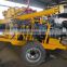 Earth auger water well drilling rig