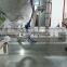 China Guangzhou GMP Standard firming lotion filling machine with hopper