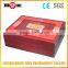 Red paper package box with yellow satin