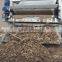 Sludge dewatering belt type filter press