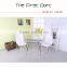 Glass top, metal frame dining table