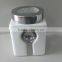 Plain white ceramic square storage jar with spoon & silicone lid