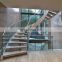 luxury modern stair glass railing curved stairs wood treads interior staircase