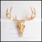 artificial resin deer animal skull in white with gold antler