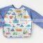 Japanese wholesale high quality new baby products useful long sleeve kids bib waterproof apron for meal with pocket EVA film