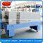 Shrink tunnel wrapping machine