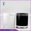 white and black glass candle jar with lid