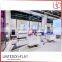 Modern hot sale retail wooden floor cosmetics display stand pink makeup display table