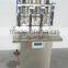 China Guangzhou factory small perfume bottle four head filling machine/equipment with negative pressure for sale