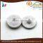 white fabric covered parts two parts snap buttons