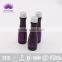 Transparent PVC plastic bottle with purple shampoo for hotel