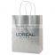 USA Made Gloss Coated Shopping Bag - made of #63 white kraft paper, dimensions are 8" x 4.75" x 10.5" and comes with your logo.