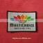 colorful textile woven badge with merrow border