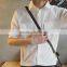 Loosely contracted pocket short sleeve shirt