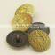 yellow metal shank button with patterns