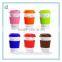 White porcelain travel coffee mug with silicone lid and sleeve in color