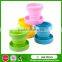 Heat resistant collapsible double wall glass cup with silicone lid