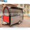 A mobile food trailer capable of producing hot dogs and barbecues.