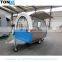 A mobile food trailer capable of producing hot dogs and barbecues.