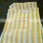 yellow and white strip shade net fence