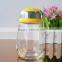 Lovely 16oz penguin Christmas glass bottle with pink color lid from Bengbu Cattelan Glassware Factory