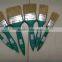 green plastic handle paint brush
