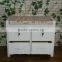white wooden cabinet with 4 drawers and 2 locker/wooden cabinet with wicker drawers