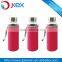 clear glass water bottle with neoprene ponch