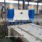 Hydraulic shearing machine with front feeder