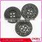 High end 4 holes black plastic lady's suit button with crack finish