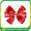 Decorative red polyester grosgrain ribbon bow