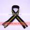 Zipper puller with golden elements