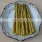 Green asparagus spears in glass jar