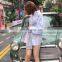 TWOTWINSTYLE Hit Color Patchwork Plaid Shirt For Women Lapel Collar Long Sleeve Lace Up