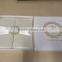 Hot sale high-end elegant ivory silk folio wedding invitations with ribbons & crystal brooches                        
                                                Quality Choice