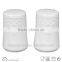 ceramic salt and pepper jars embossed round white