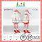 Red and white christmas long legs sitting