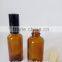 small round amber glass essential oil personal care glass bottle with cap