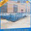 Adjustable container loading and unloading ramp lift