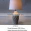flowing ceramic base and fabric shade table lamp